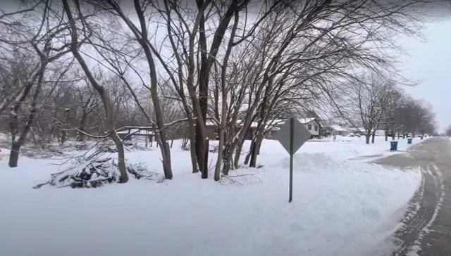 a view of snow on the road