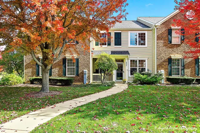 front view of a house with a yard