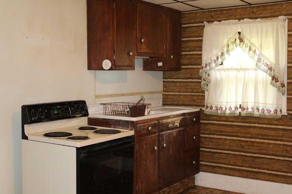 145 Ridge Road Darlington, PA 16115 - Photo 8 of 18 a kitchen with a stove and a window