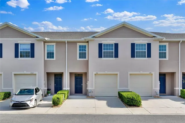 a front view of a house with yard
