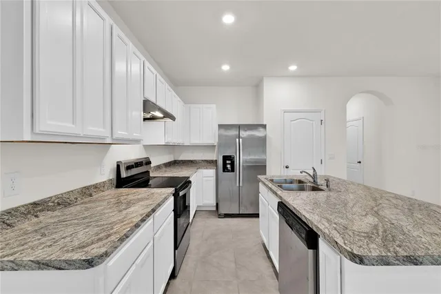 a kitchen with a sink and cabinets