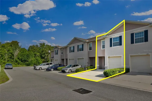a view of multiple houses with a street