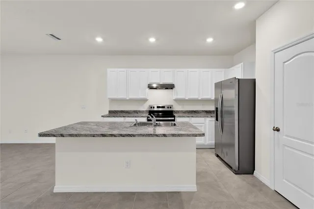 a view of an empty room with windows