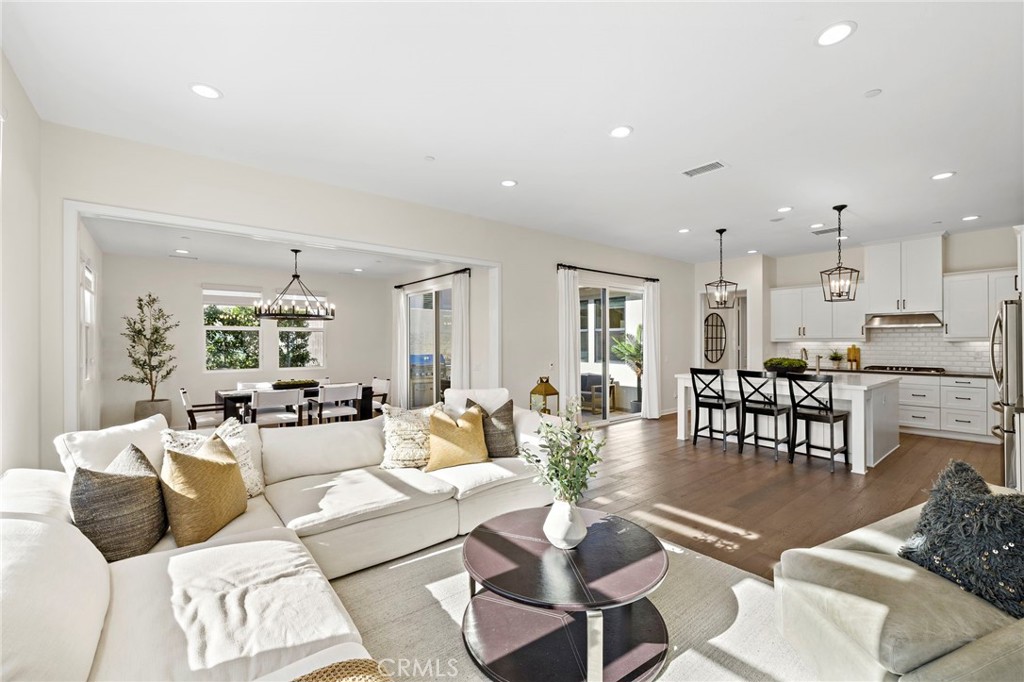 44 Jarano Street Rancho Mission Viejo, CA 92694 - Photo 1 of 65 a living room with furniture wooden floor and a table