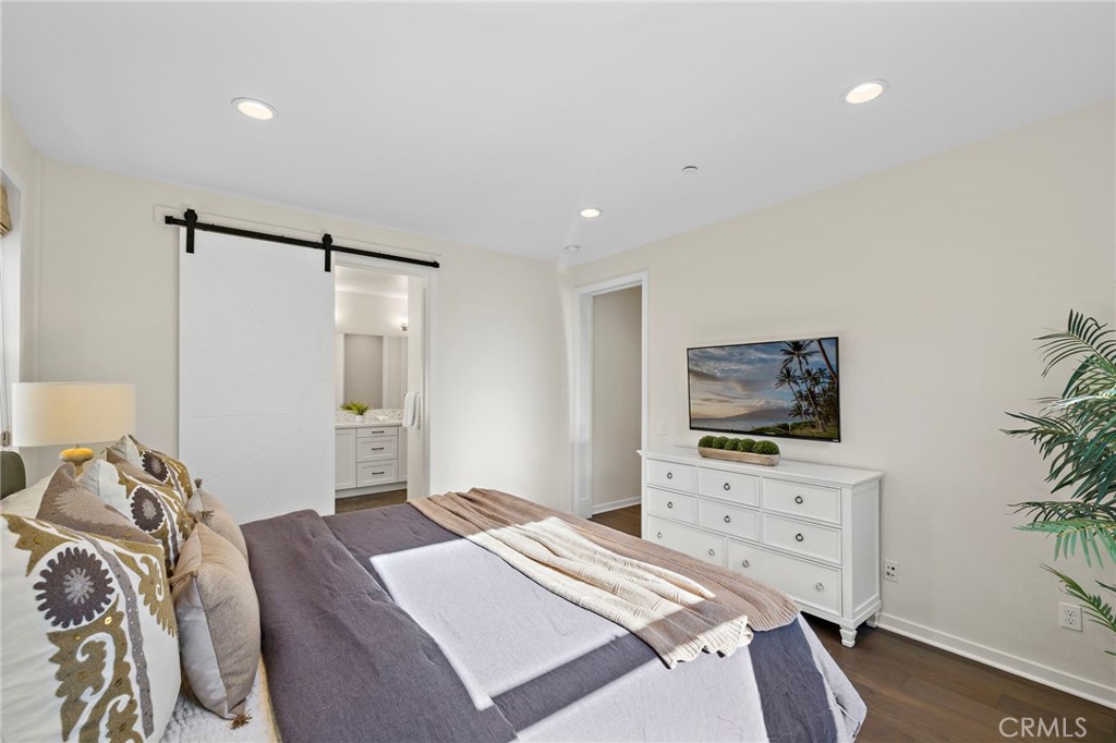 44 Jarano Street Rancho Mission Viejo, CA 92694 - Photo 13 of 65 a bedroom with a bed and a television