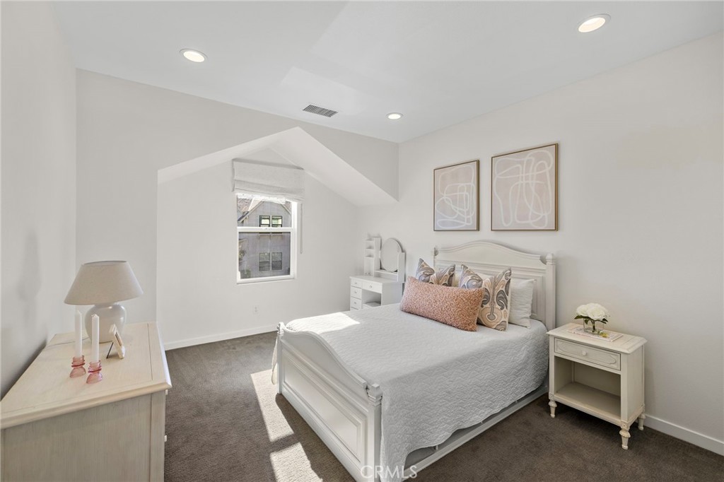 44 Jarano Street Rancho Mission Viejo, CA 92694 - Photo 23 of 65 a bedroom with a bed and a lamp on table