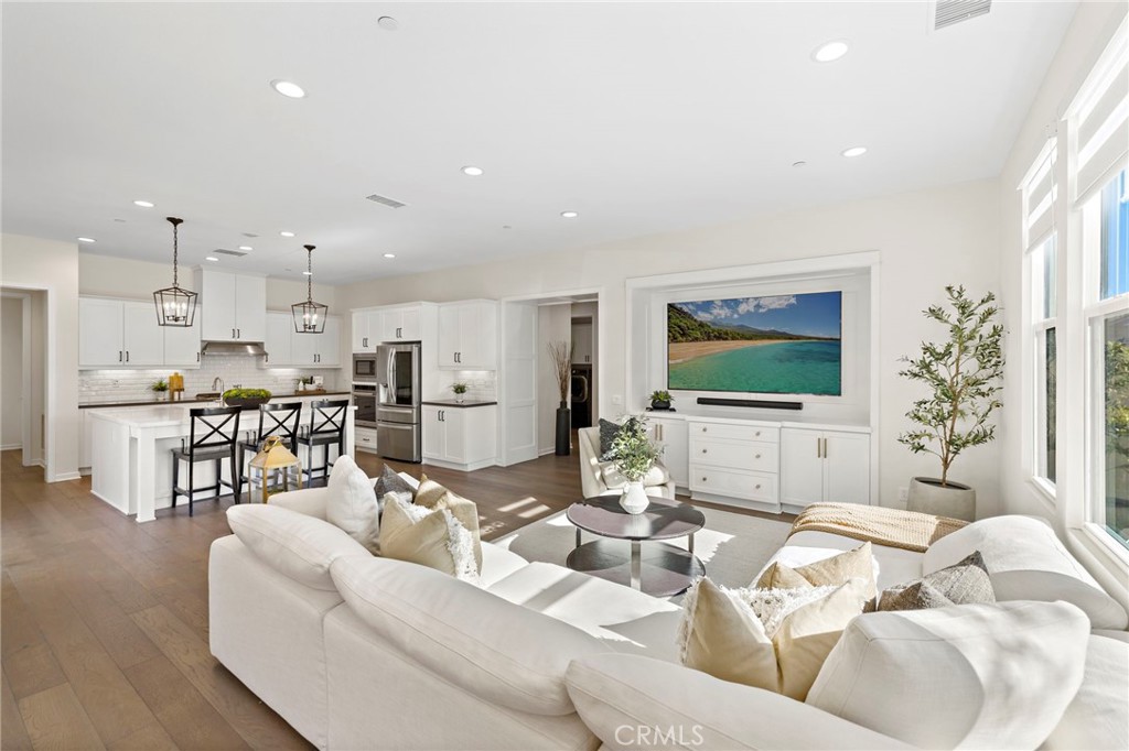 44 Jarano Street Rancho Mission Viejo, CA 92694 - Photo 3 of 65 a living room with furniture and a flat screen tv