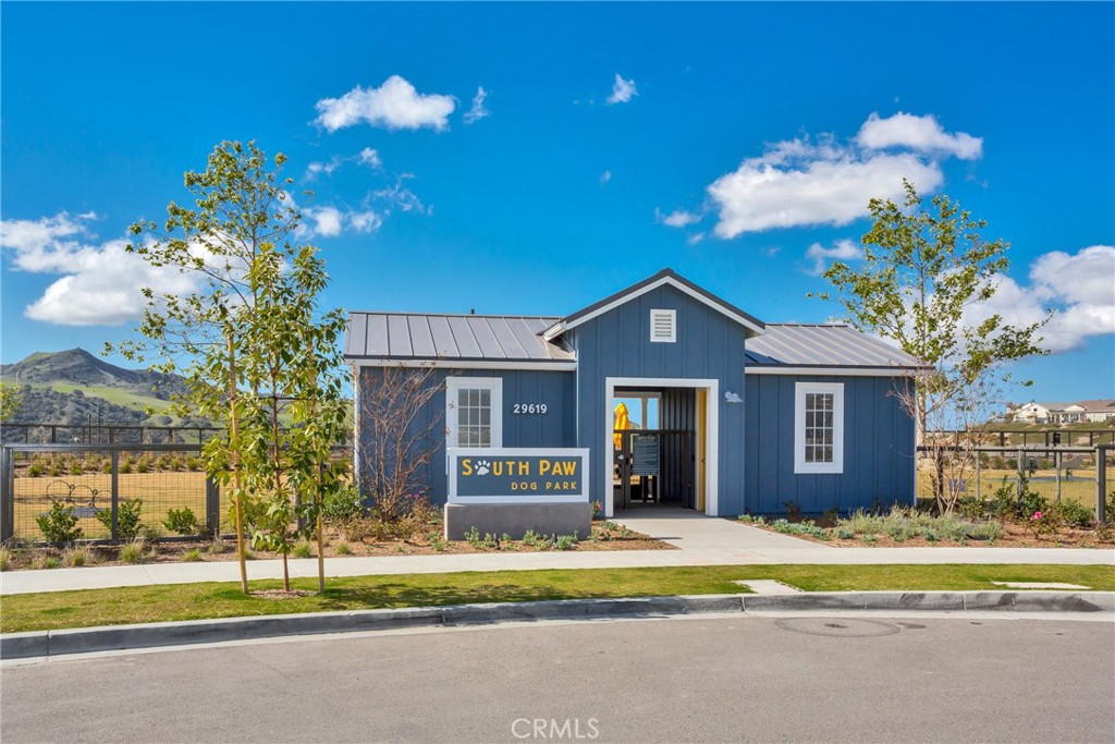 44 Jarano Street Rancho Mission Viejo, CA 92694 - Photo 52 of 65 a front view of a house with a yard and a garage