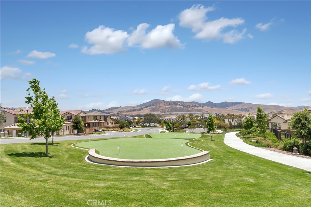 44 Jarano Street Rancho Mission Viejo, CA 92694 - Photo 53 of 65 a view of a lake with a mountain in the background