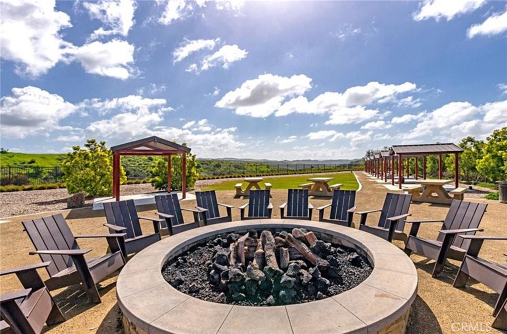 44 Jarano Street Rancho Mission Viejo, CA 92694 - Photo 60 of 65 a view of a swimming pool with a patio