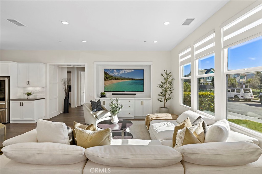 44 Jarano Street Rancho Mission Viejo, CA 92694 - Photo 7 of 65 a living room with furniture and a large window