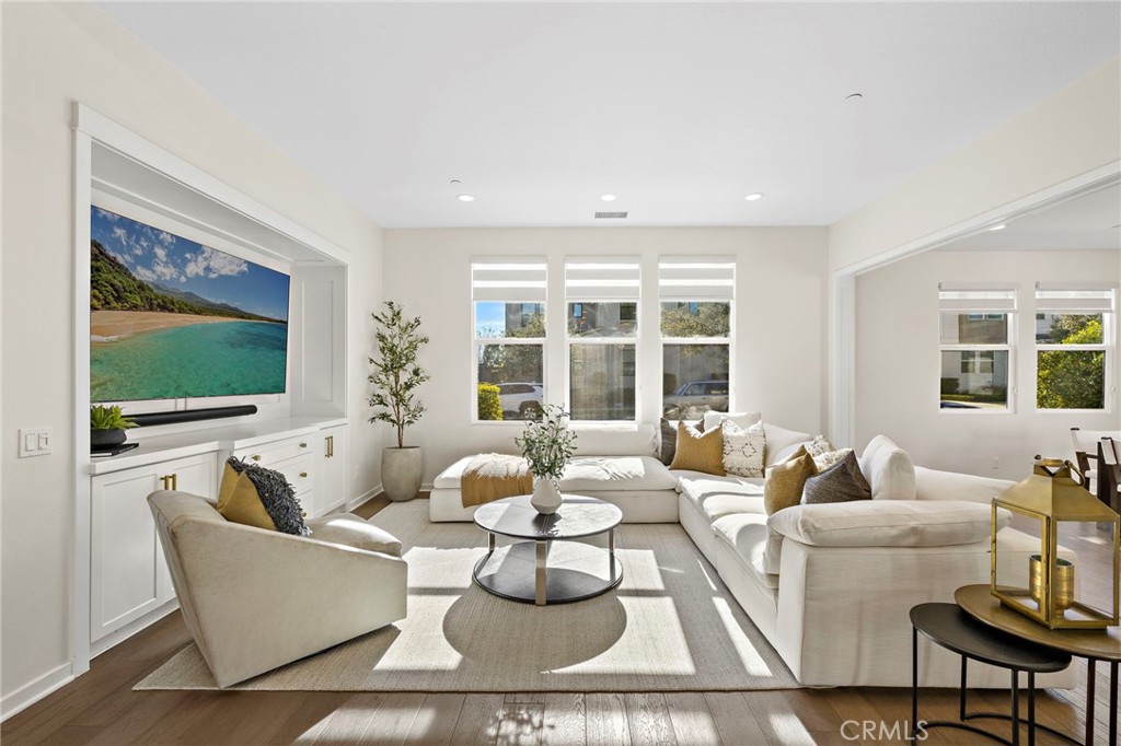44 Jarano Street Rancho Mission Viejo, CA 92694 - Photo 8 of 65 a living room with furniture and a flat screen tv