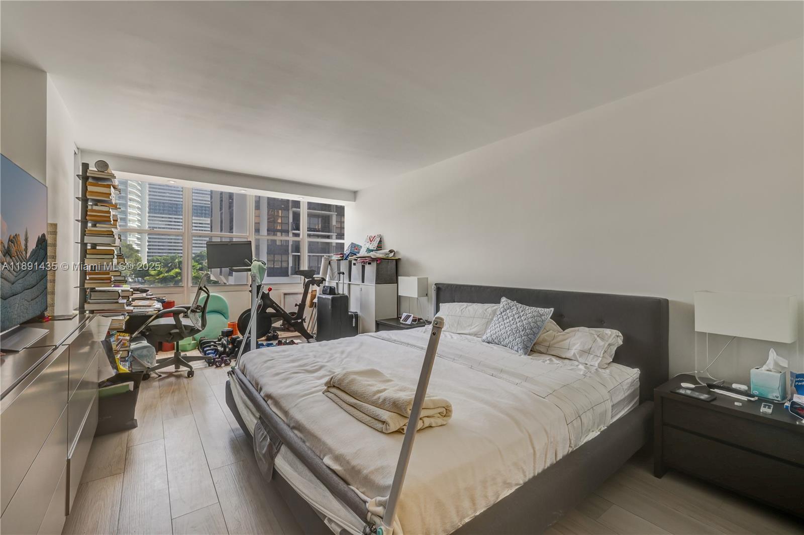 1901 Brickell Avenue, Unit B413 Miami, FL 33129 - Photo 15 of 33 a living room with furniture and a large window