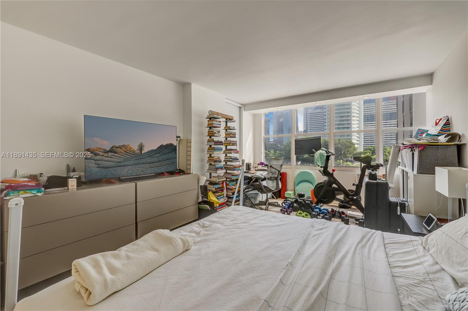 1901 Brickell Avenue, Unit B413 Miami, FL 33129 - Photo 17 of 33 a bedroom with furniture and a large window