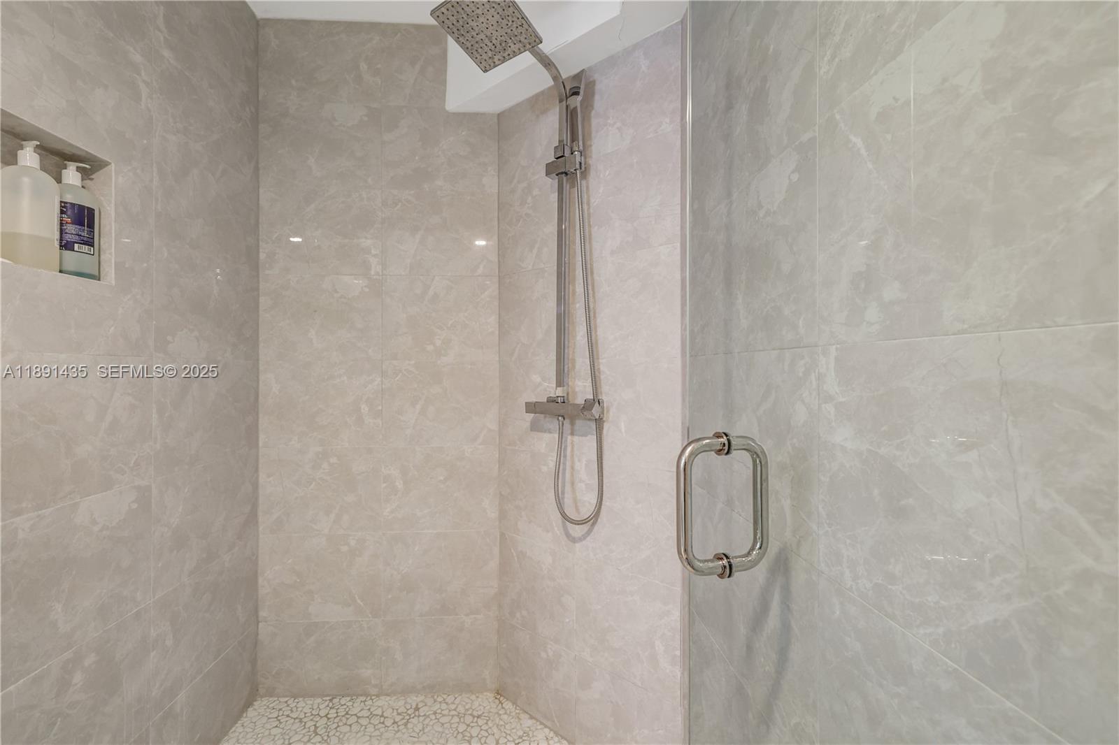 1901 Brickell Avenue, Unit B413 Miami, FL 33129 - Photo 21 of 33 a bathroom with a glass shower door