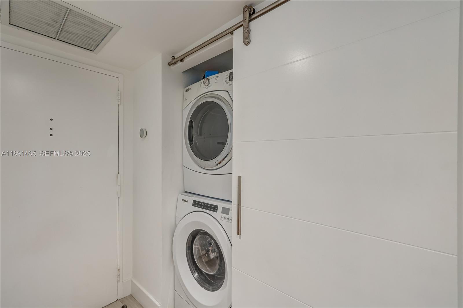 1901 Brickell Avenue, Unit B413 Miami, FL 33129 - Photo 22 of 33 a utility room with dryer and washer