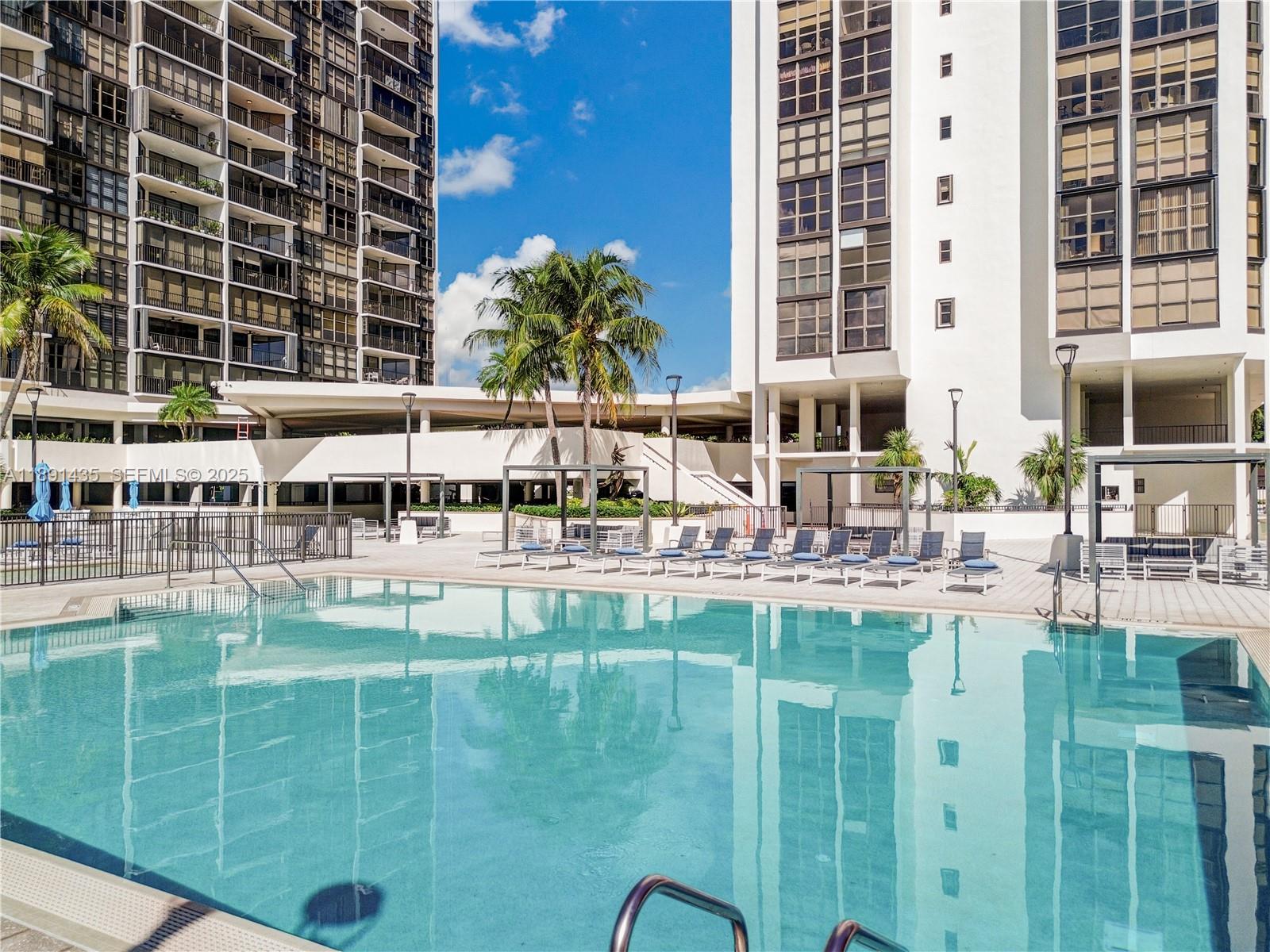 1901 Brickell Avenue, Unit B413 Miami, FL 33129 - Photo 32 of 33 a swimming pool view with outdoor seating
