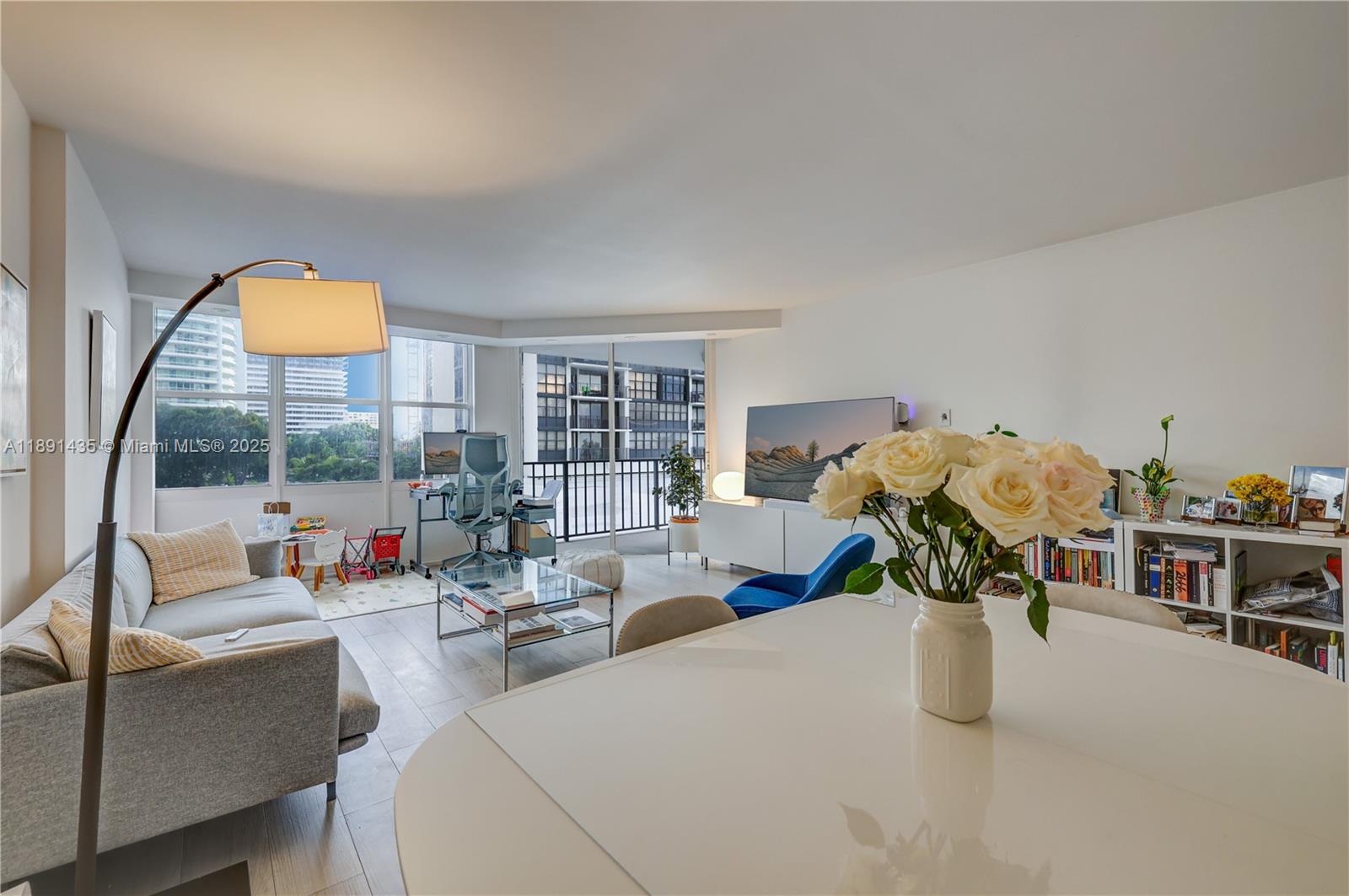 1901 Brickell Avenue, Unit B413 Miami, FL 33129 - Photo 6 of 33 a living room with furniture and a potted plant