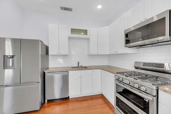 a kitchen with a stove microwave and refrigerator