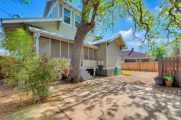 a view of a backyard with a small cabin and a chair