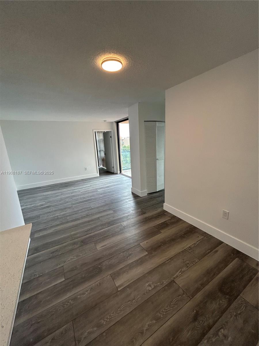 11800 Southwest 18th Street, Unit 5274 Miami, FL 33175 - Photo 4 of 12 a view of a room with wooden floor