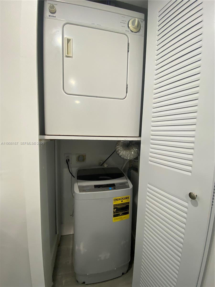 11800 Southwest 18th Street, Unit 5274 Miami, FL 33175 - Photo 8 of 12 a utility room with dryer and washer