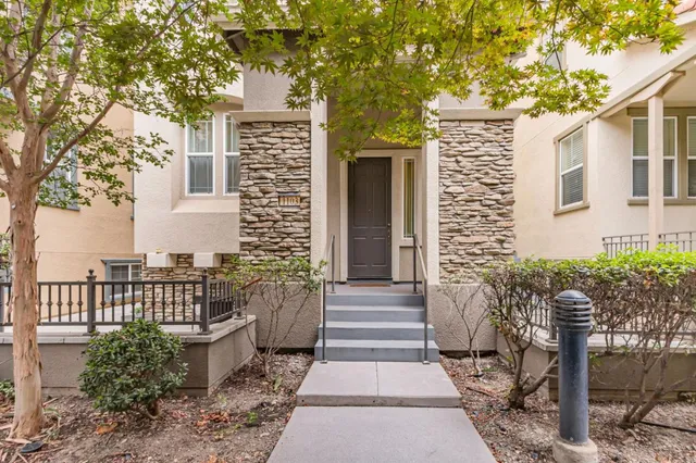 a front view of a house with garden