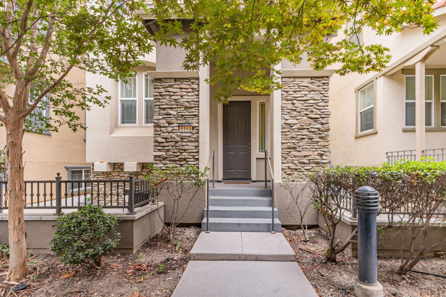 a front view of a house with garden