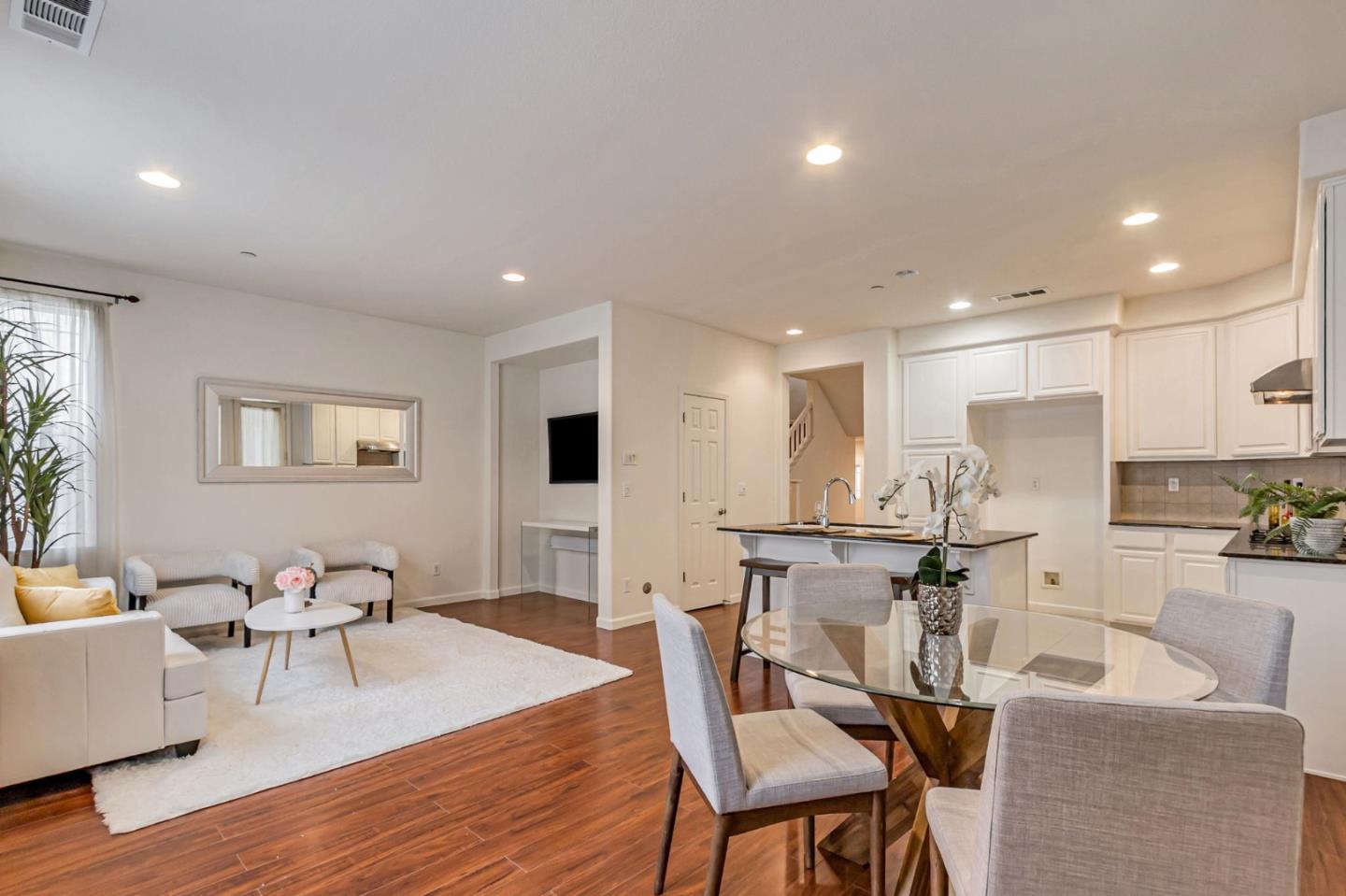 1103 Vida Larga Loop Milpitas, CA 95035 - Photo 15 of 44 a view of a dining room with furniture and wooden floor