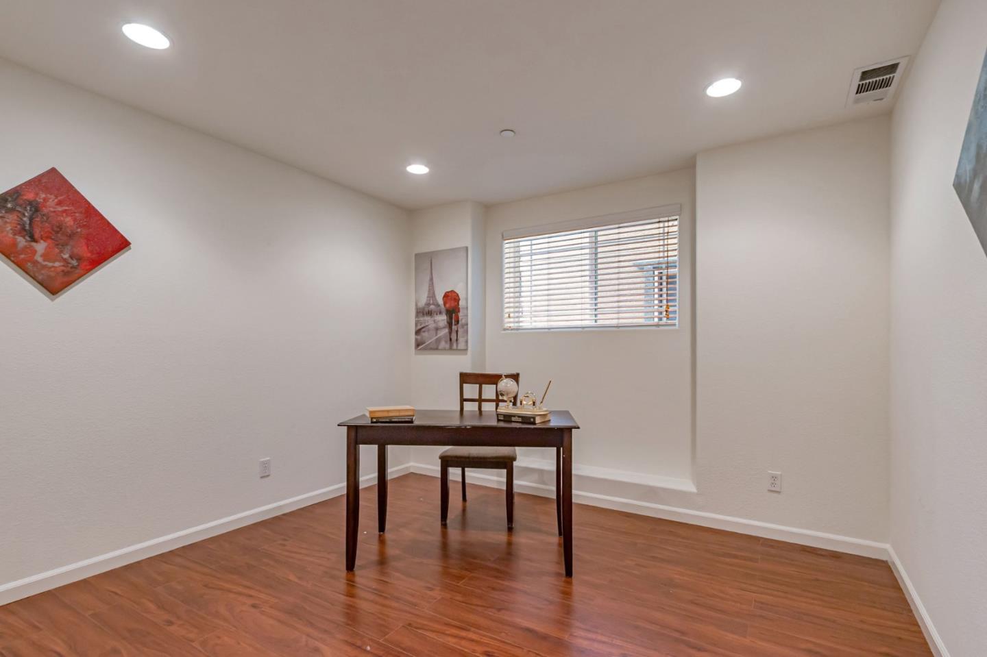 1103 Vida Larga Loop Milpitas, CA 95035 - Photo 16 of 44 a workspace with furniture and wooden floor