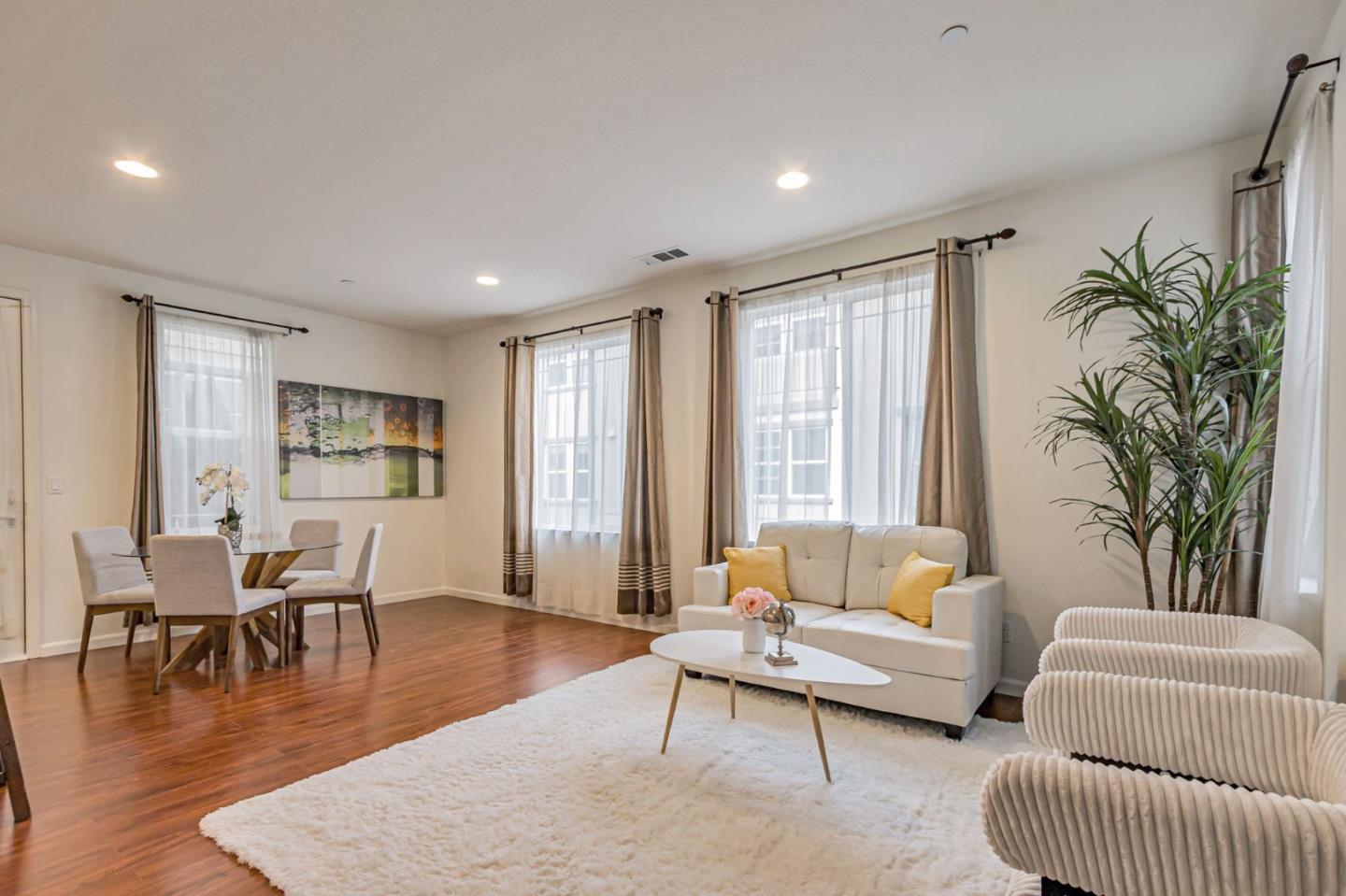 1103 Vida Larga Loop Milpitas, CA 95035 - Photo 2 of 44 a living room with furniture and wooden floor