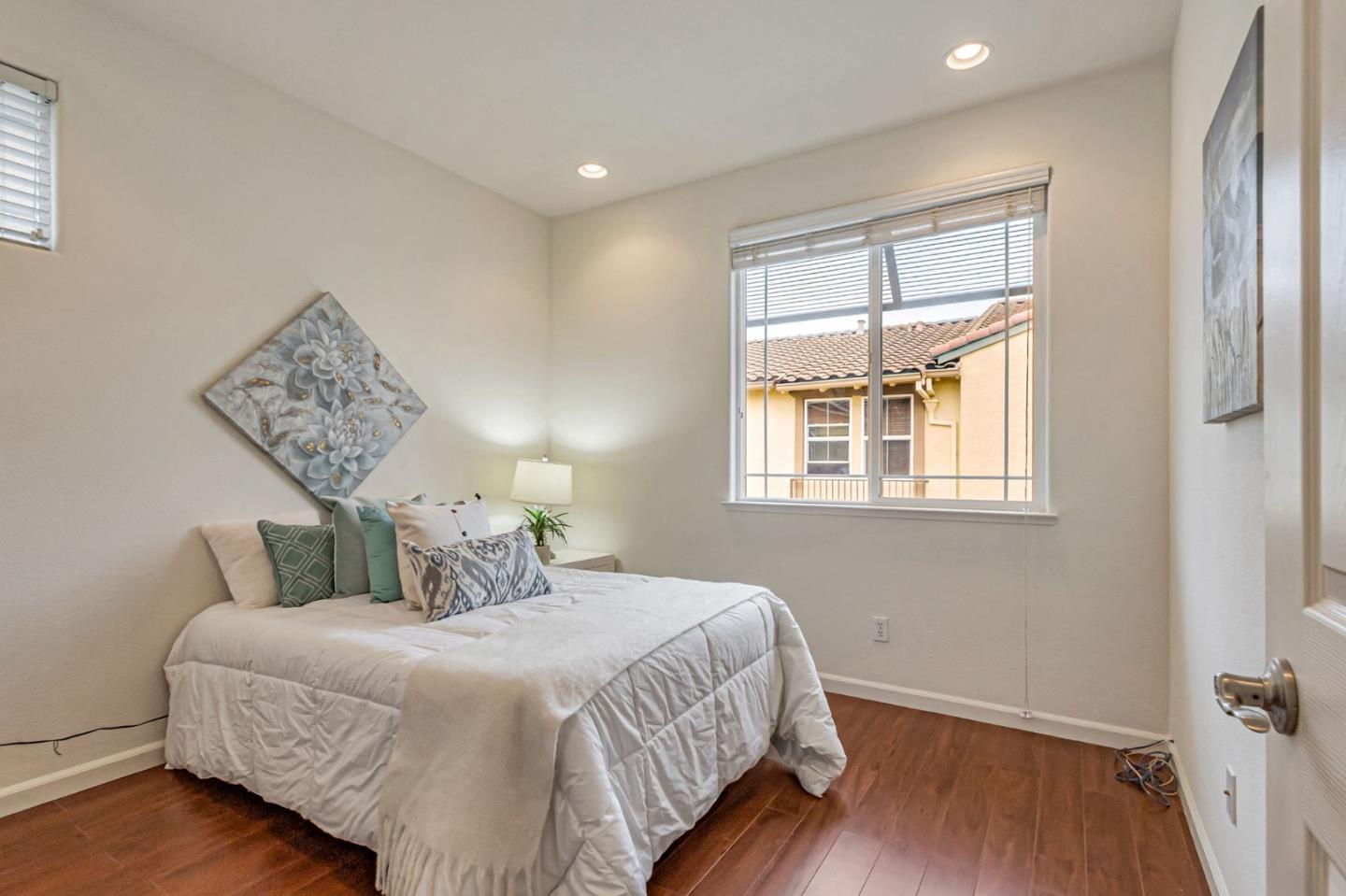 1103 Vida Larga Loop Milpitas, CA 95035 - Photo 22 of 44 a bedroom with a bed and a window