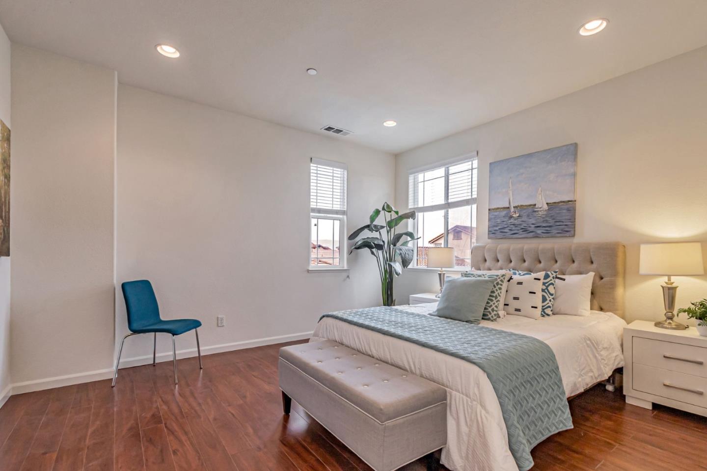 1103 Vida Larga Loop Milpitas, CA 95035 - Photo 24 of 44 a bedroom with a bed and a chair