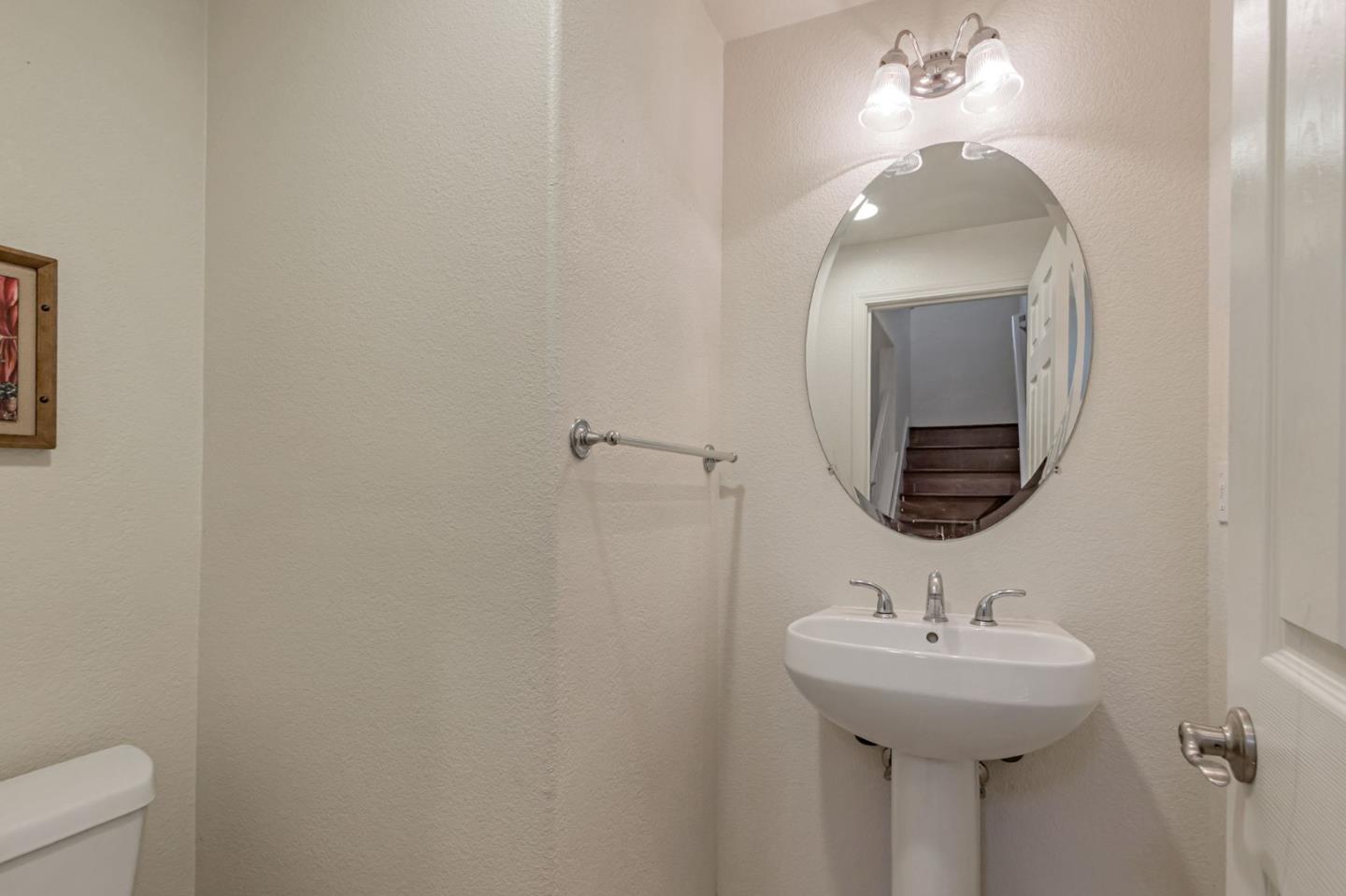 1103 Vida Larga Loop Milpitas, CA 95035 - Photo 28 of 44 a bathroom with a sink and mirror