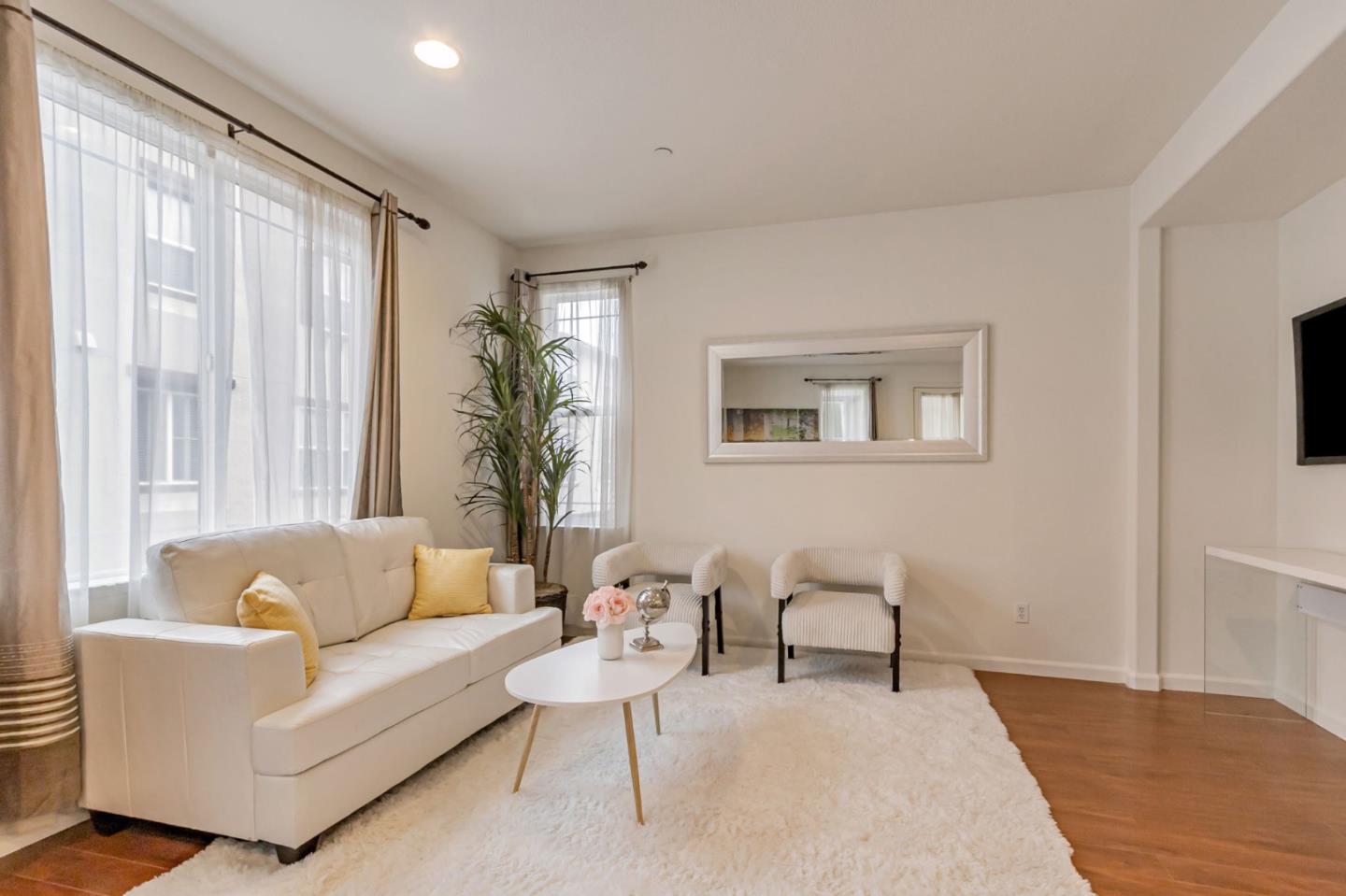 1103 Vida Larga Loop Milpitas, CA 95035 - Photo 3 of 44 a living room with furniture and a large window