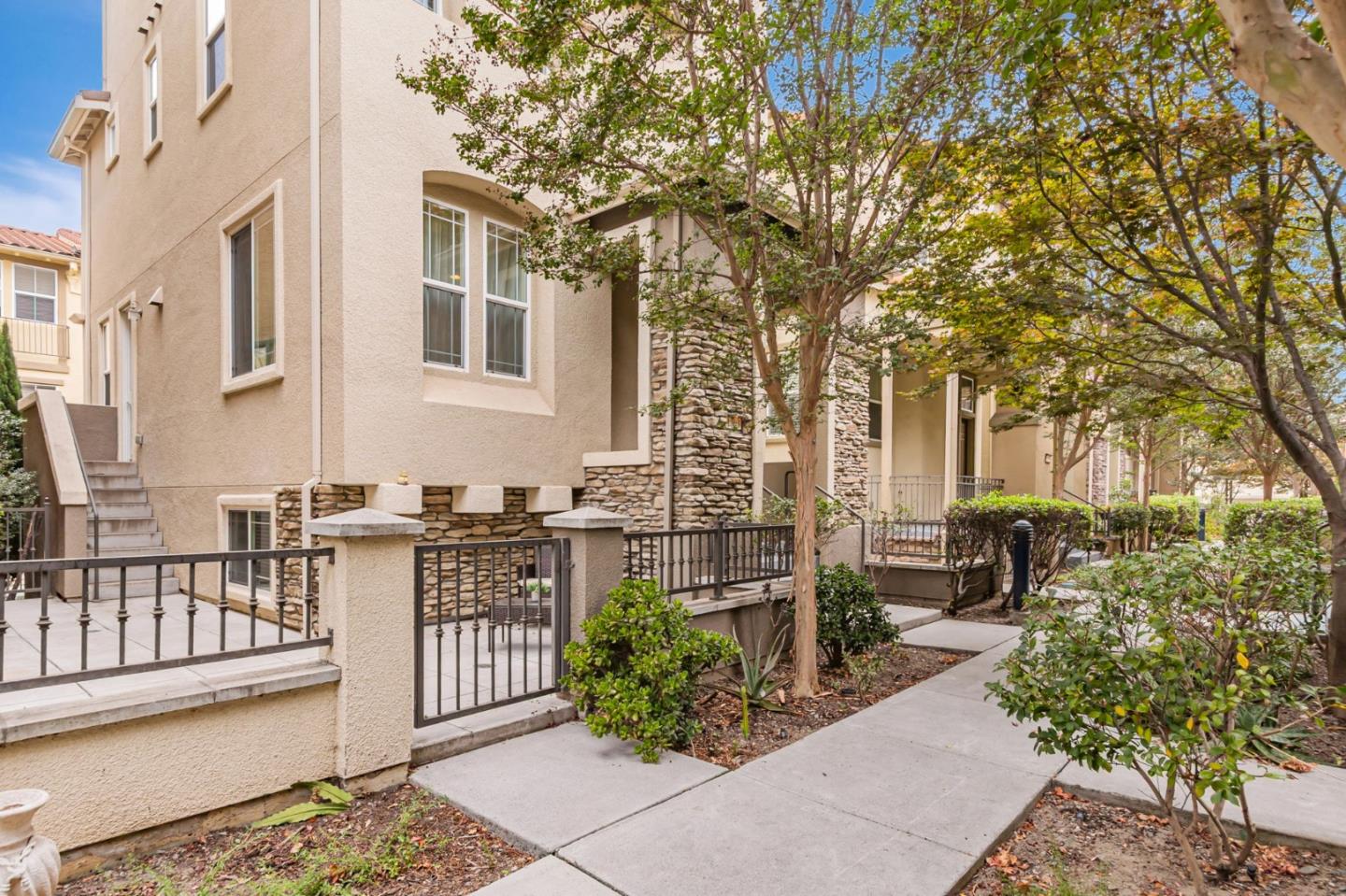 1103 Vida Larga Loop Milpitas, CA 95035 - Photo 4 of 44 a view of a patio with couches table and chairs and potted plants