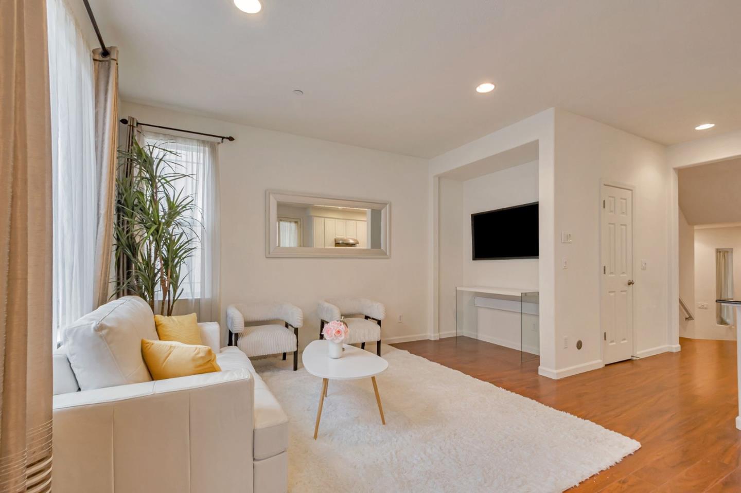 1103 Vida Larga Loop Milpitas, CA 95035 - Photo 6 of 44 a living room with furniture and a flat screen tv