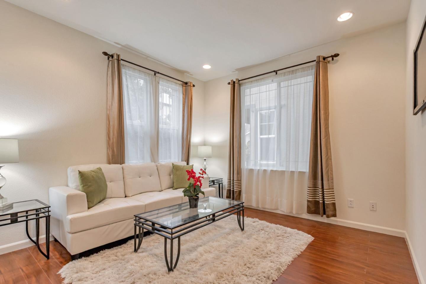 1103 Vida Larga Loop Milpitas, CA 95035 - Photo 8 of 44 a living room with furniture and a window