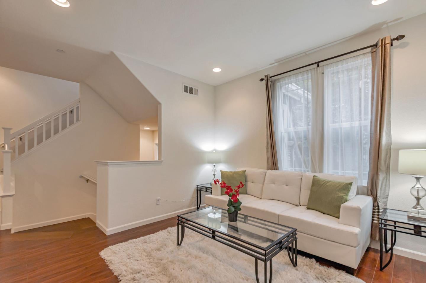 1103 Vida Larga Loop Milpitas, CA 95035 - Photo 9 of 44 a living room with furniture and wooden floor