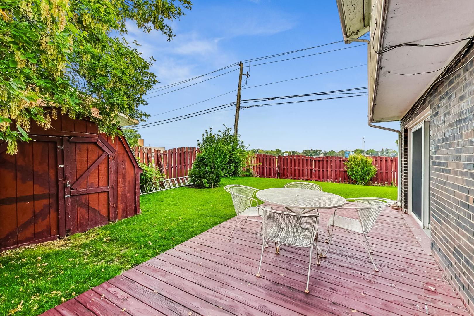 8803 Robin Drive Des Plaines, IL 60016 - Photo 15 of 18 a view of a chairs with a backyard