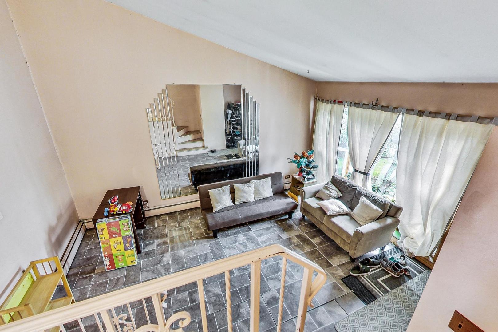 8803 Robin Drive Des Plaines, IL 60016 - Photo 4 of 18 a living room with furniture and a wooden floor