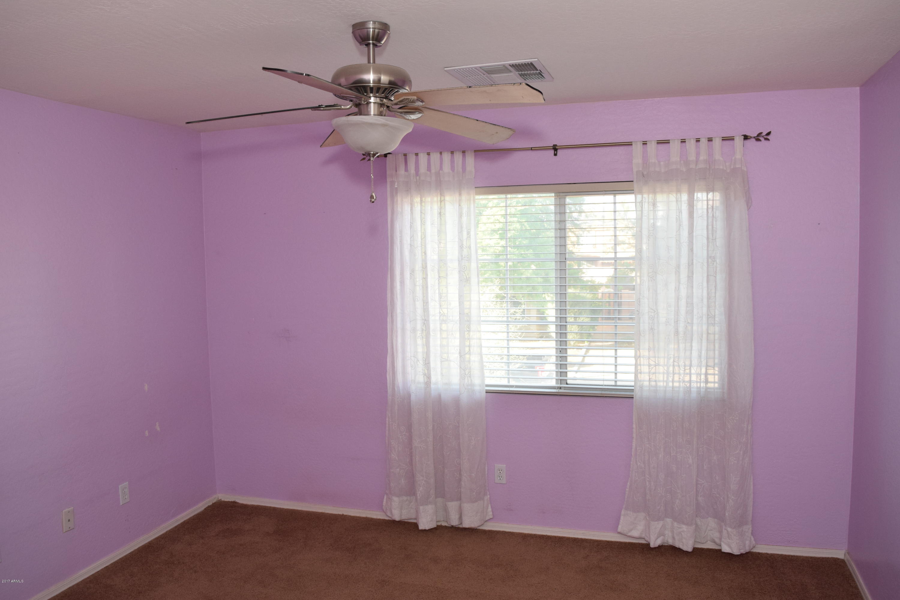 15761 West Calavar Road Surprise, AZ 85379 - Photo 21 of 36 a view of a livingroom with a window