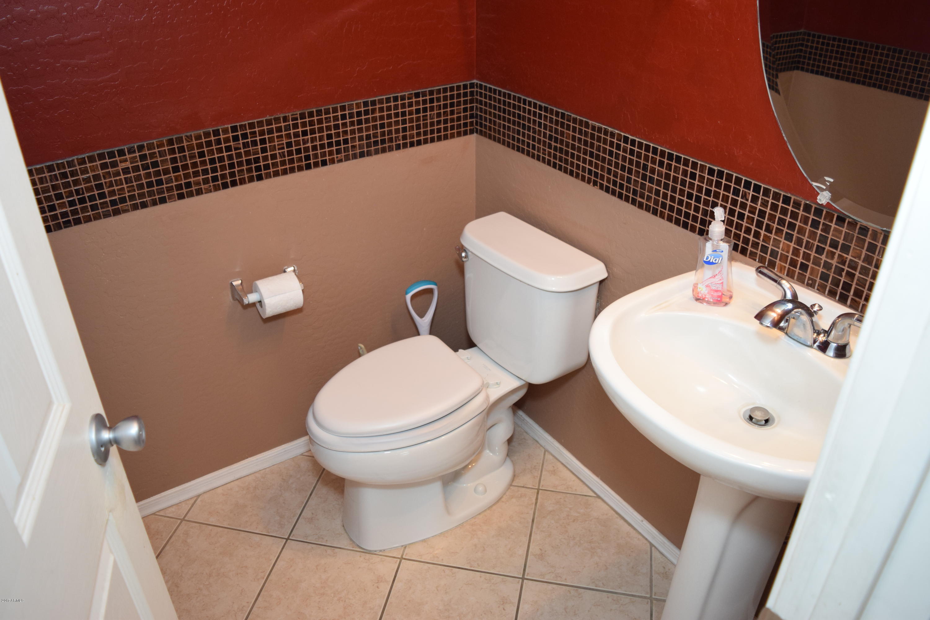 15761 West Calavar Road Surprise, AZ 85379 - Photo 33 of 36 a bathroom with a toilet and a sink