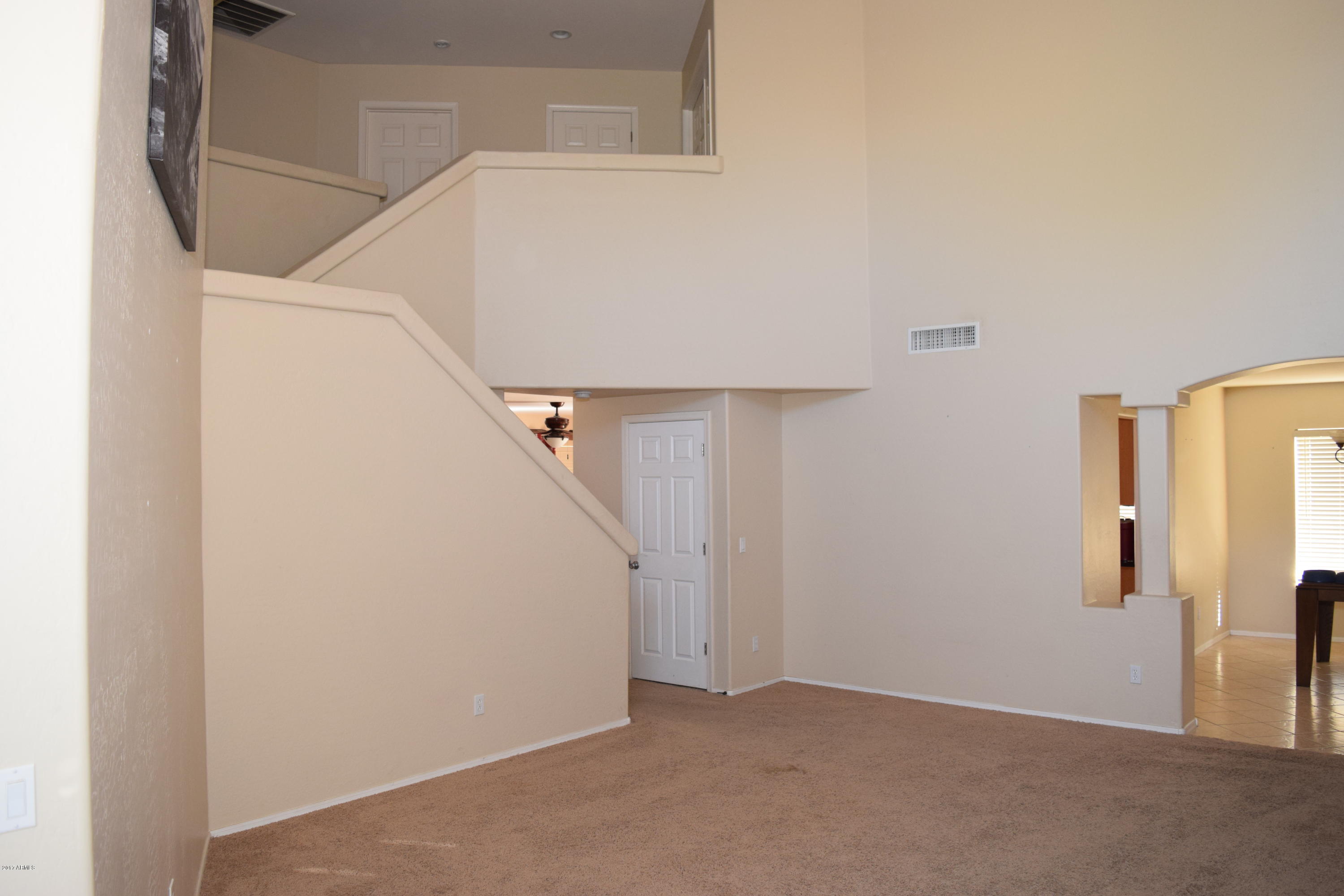 15761 West Calavar Road Surprise, AZ 85379 - Photo 6 of 36 a view of a hallway with staircase