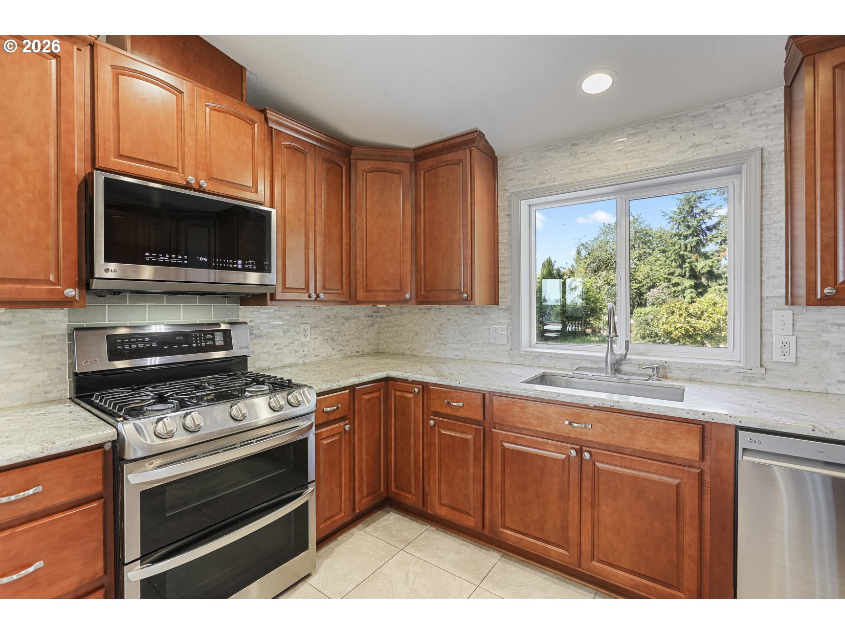 33411 Blaha Road Warren, OR 97053 - Photo 15 of 48 a kitchen with stainless steel appliances a stove sink and microwave
