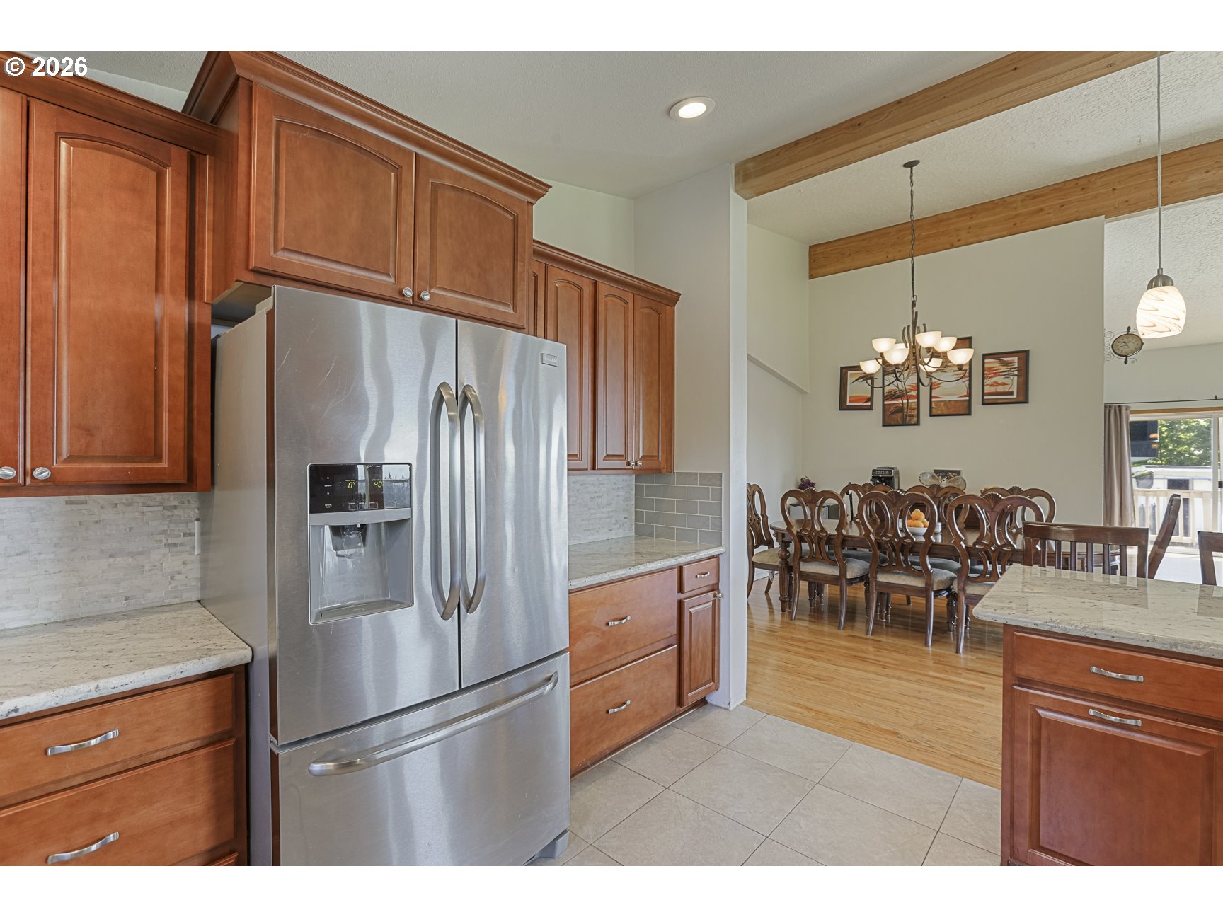 33411 Blaha Road Warren, OR 97053 - Photo 16 of 48 a kitchen with stainless steel appliances granite countertop a refrigerator and a dining table