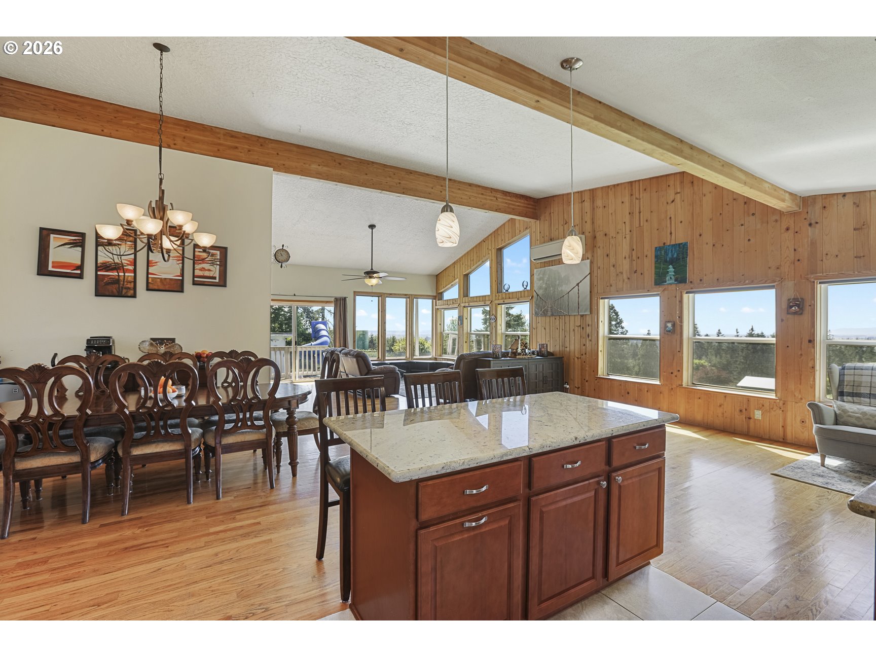 33411 Blaha Road Warren, OR 97053 - Photo 17 of 48 a kitchen with a dining table chairs and large window