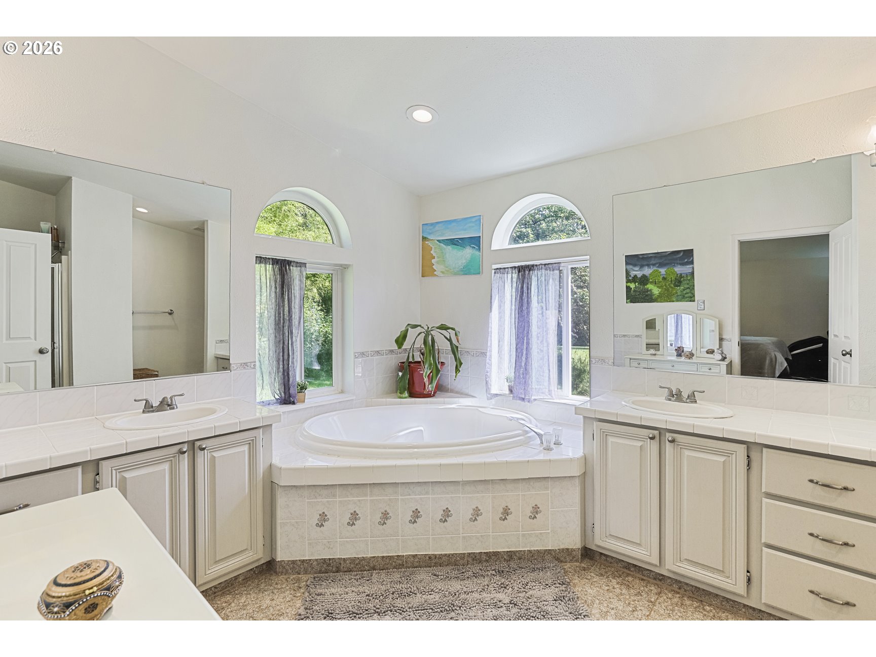 33411 Blaha Road Warren, OR 97053 - Photo 20 of 48 a spacious bathroom with a granite countertop sink and a mirror