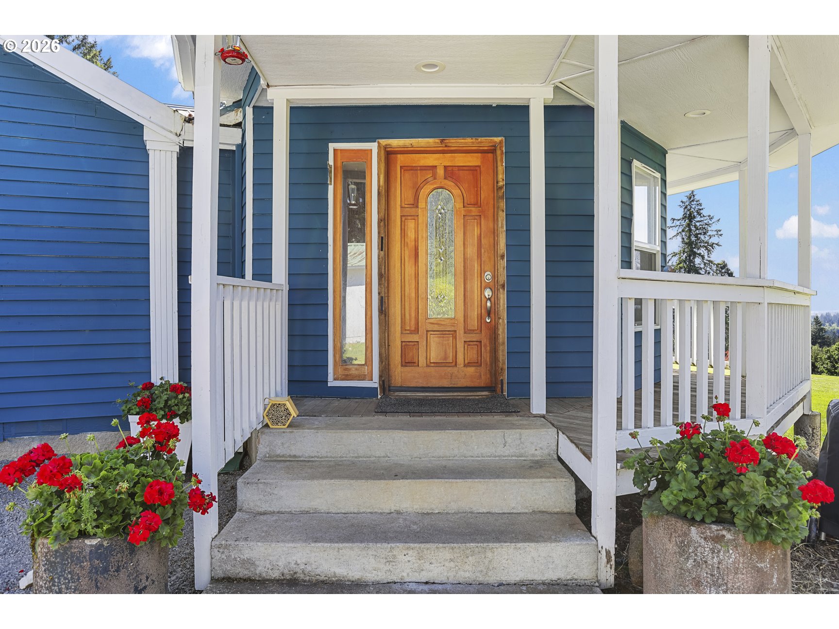 33411 Blaha Road Warren, OR 97053 - Photo 2 of 48 a front view of a house with a porch