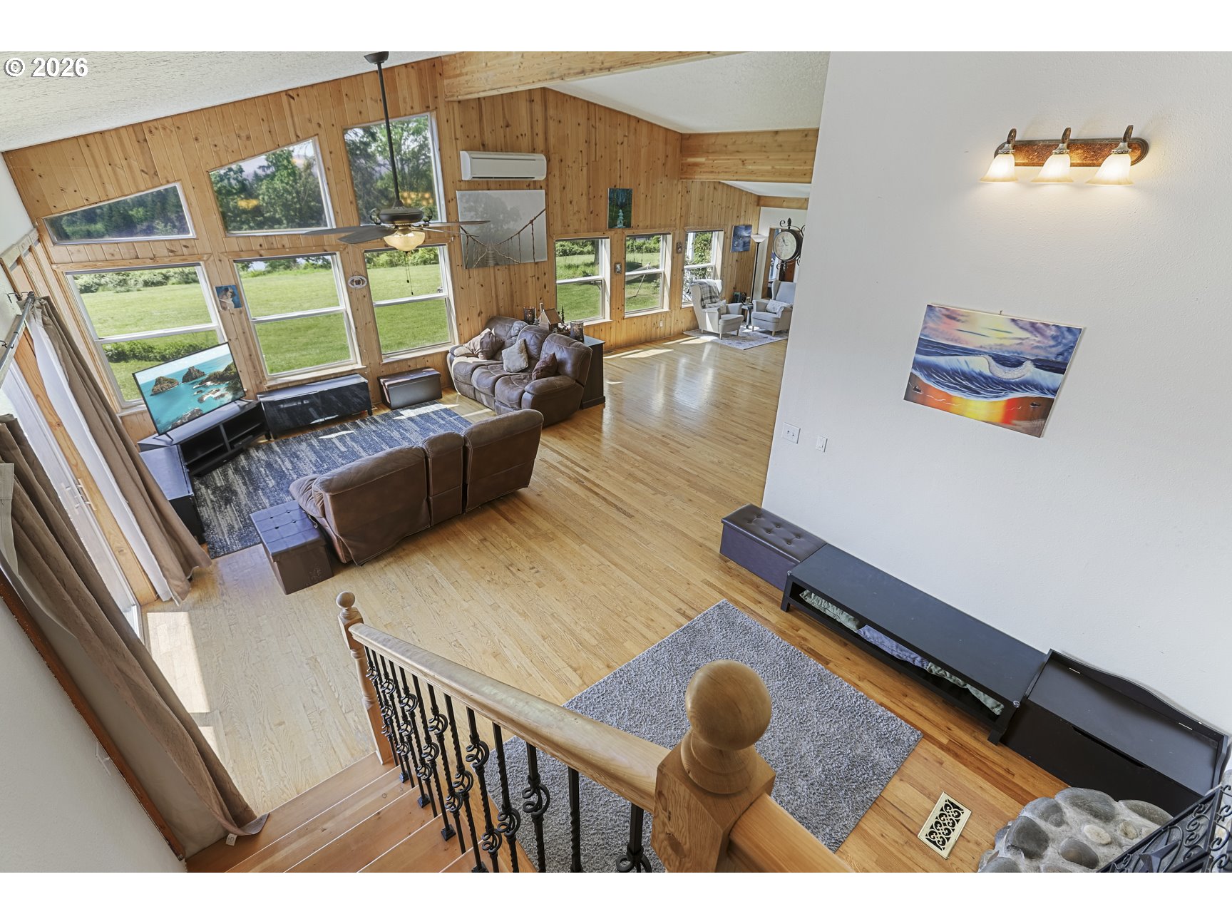 33411 Blaha Road Warren, OR 97053 - Photo 26 of 48 a living room with furniture and a floor to ceiling window